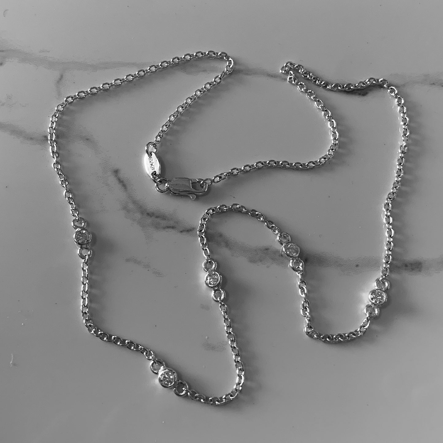 Necklace with 5x3mm, 0.10ct. Diamonds.