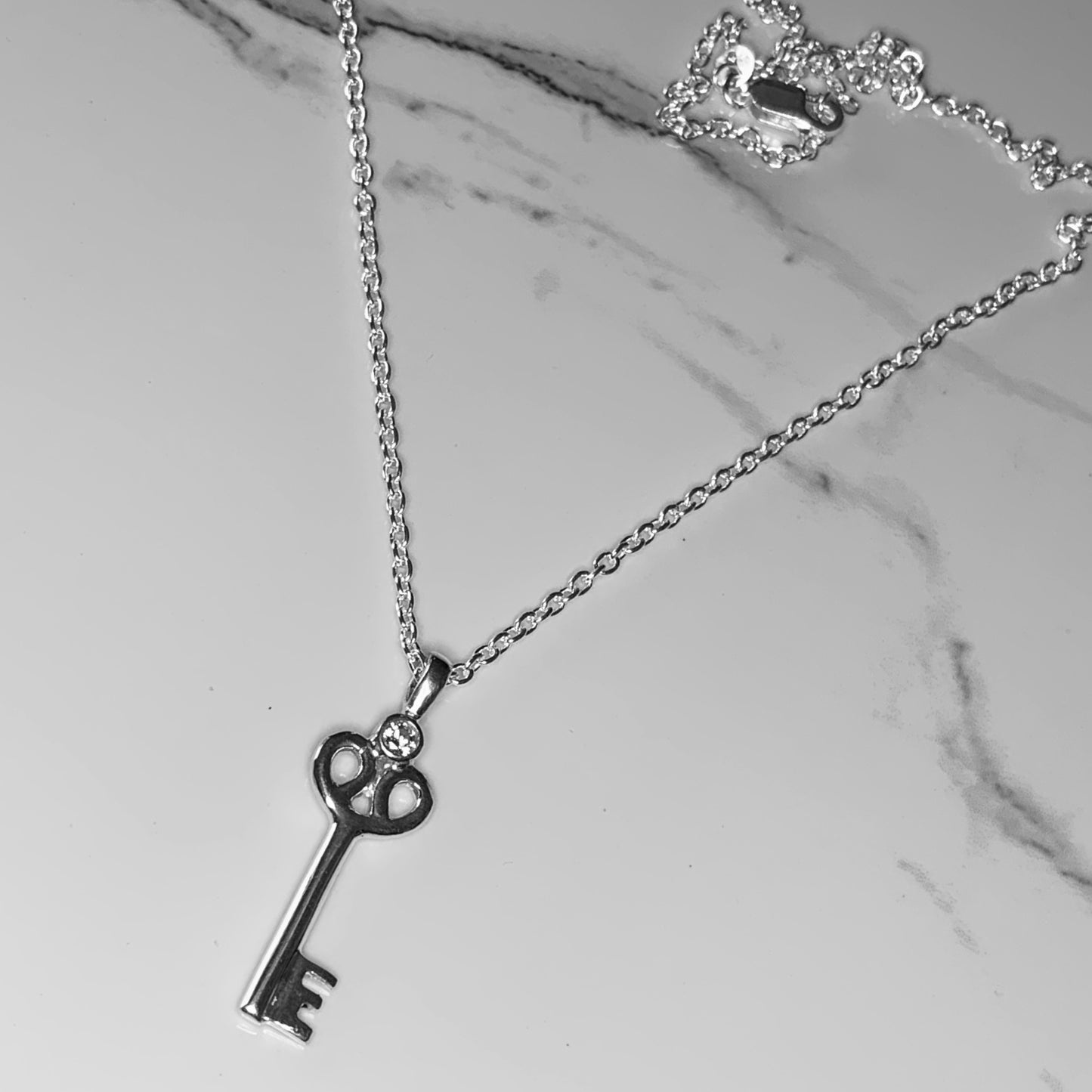 Key Pendant with 3mm, 0.10ct. Diamond