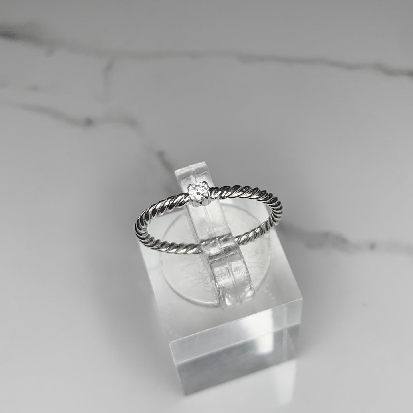 Solitaire Ring with 2.5mm, 0.06ct. Diamond on rope band.