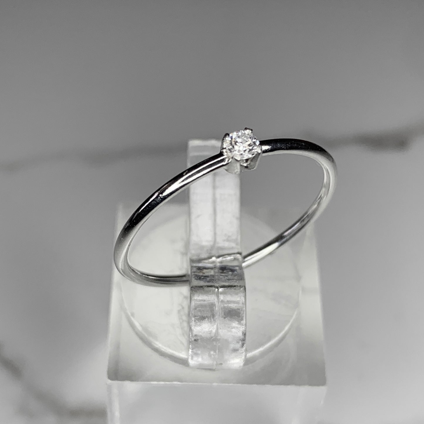 Solitaire Ring with 2.5mm, 0.06ct. Diamond with plain band.