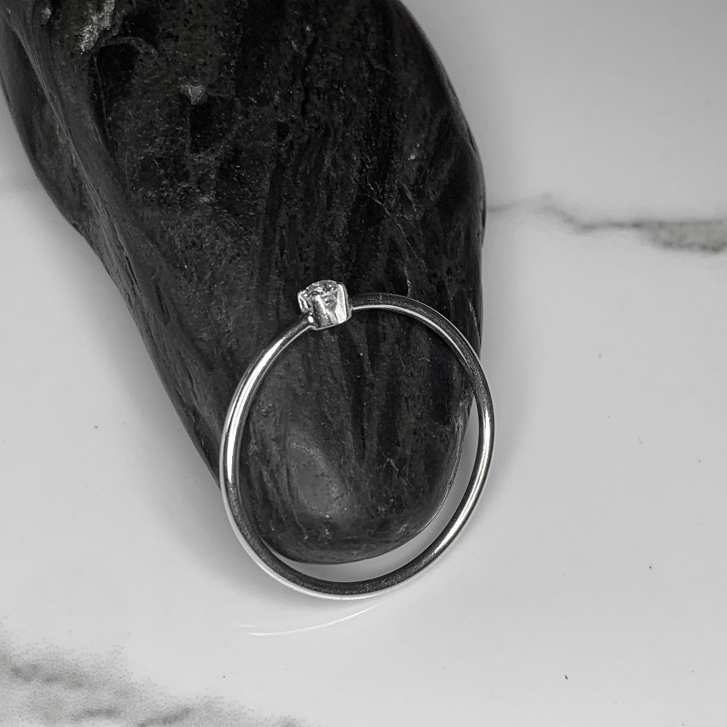 Solitaire Ring with 2.5mm, 0.06ct. Diamond with plain band.