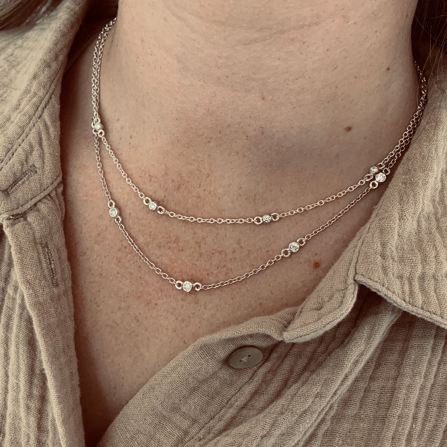 Necklace with 5x3mm, 0.10ct. Diamonds.