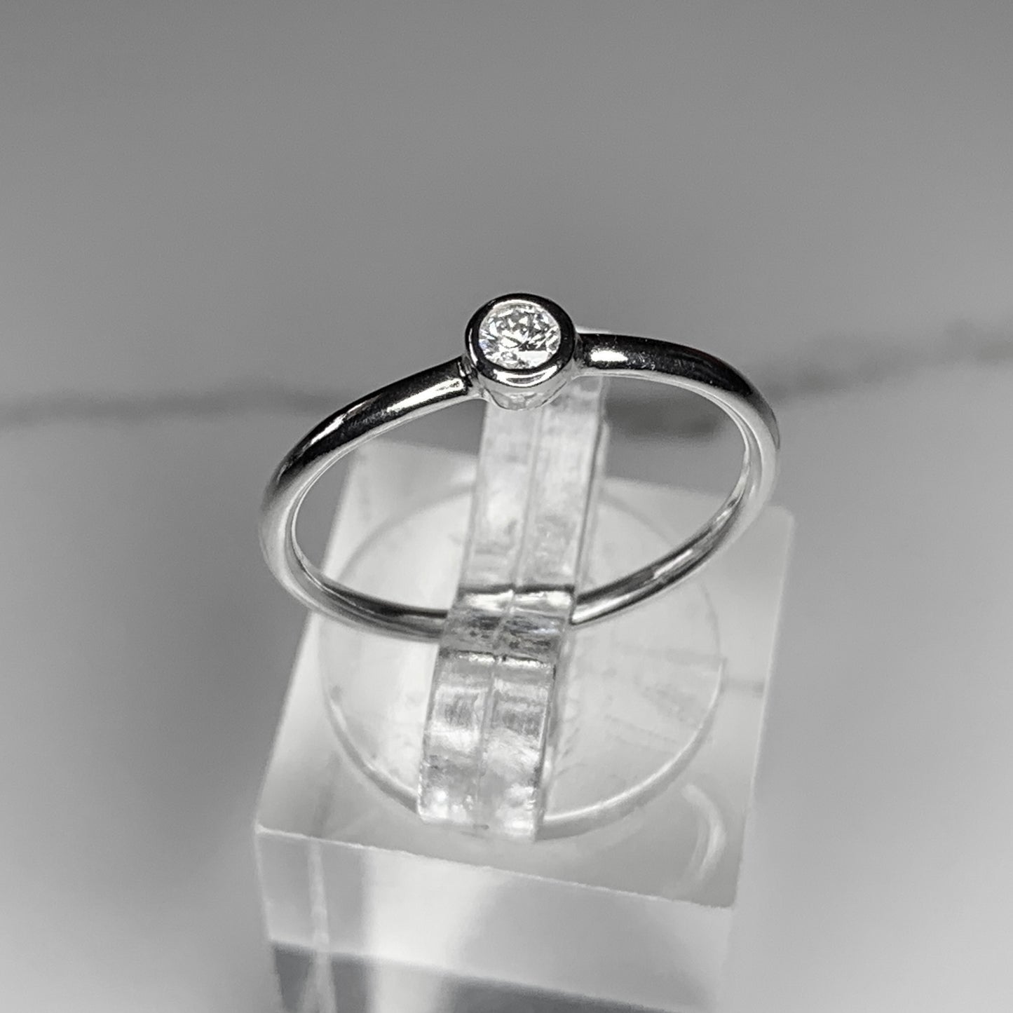 Solitaire Ring with 3mm, 0.10ct.  Bezel set Diamond